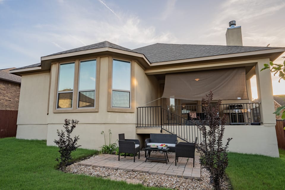 backyard with some seating. 