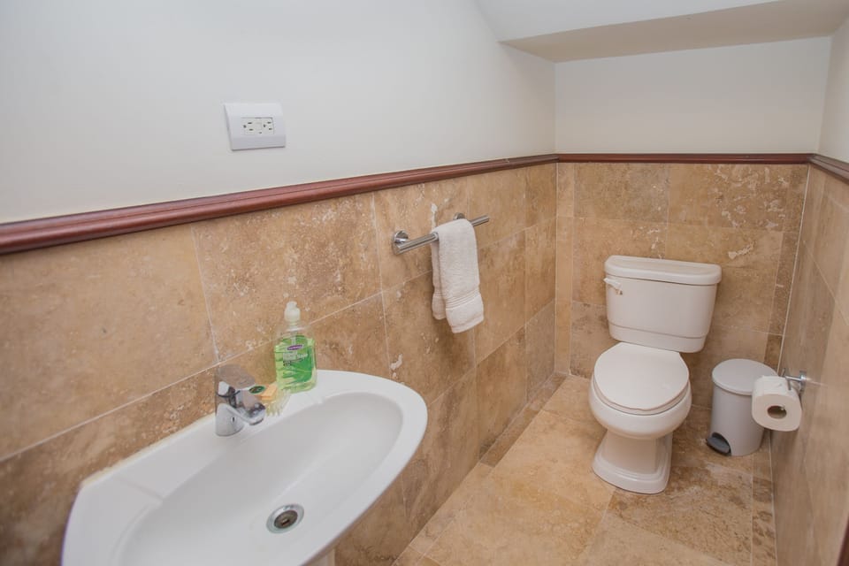 Second half bathroom by the kitchen