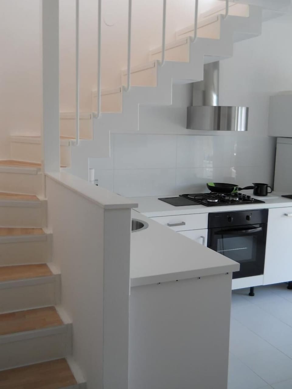 Stairs and a part of the kitchen