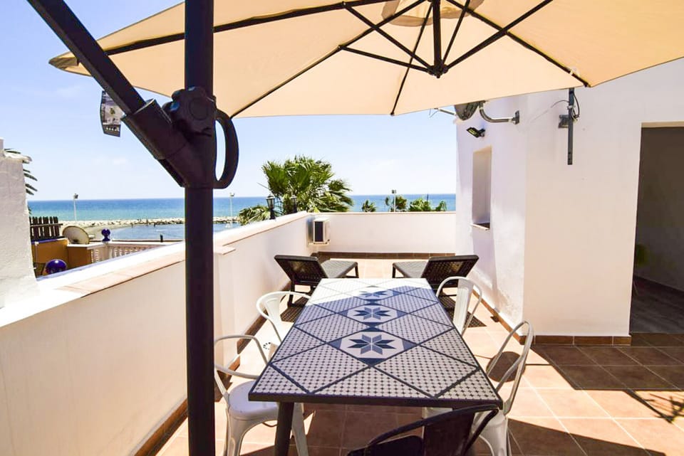 Terrace with a beautiful view of the beach, perfect for enjoying the outdoors