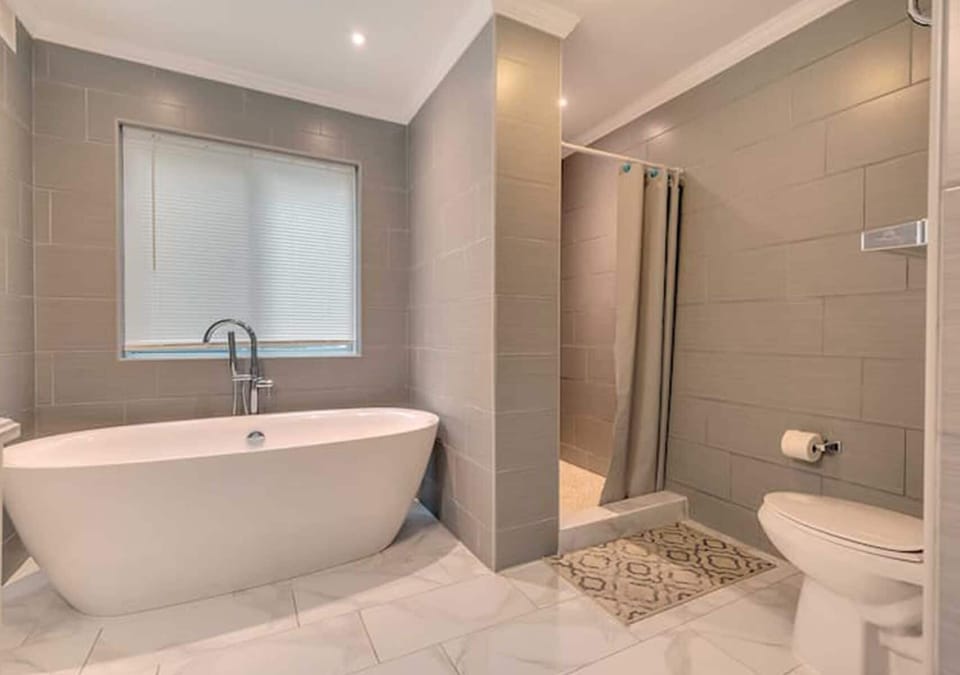 Relaxing bathroom featuring a luxurious bathtub