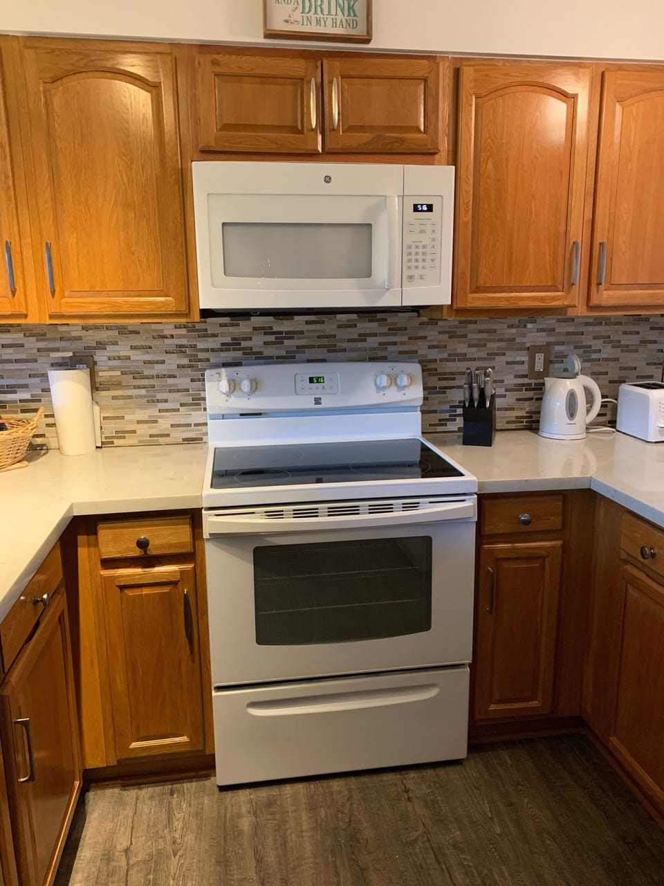 Fully stocked kitchen with standard size refrigerator.