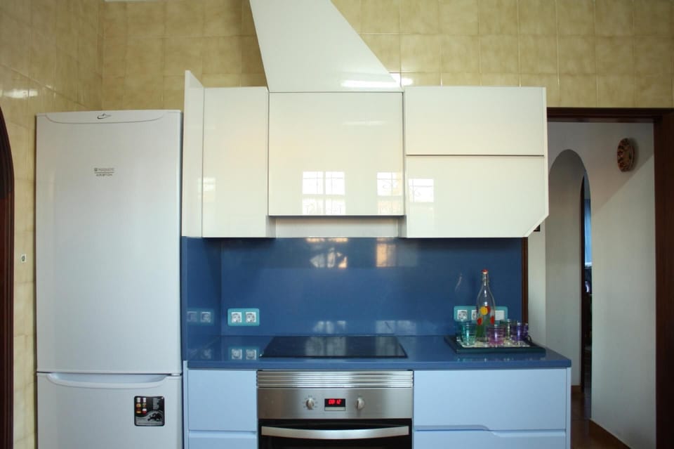The kitchen is fully equipped with plenty of storage space