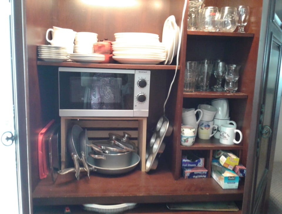 Armore contains flatware and microwave.