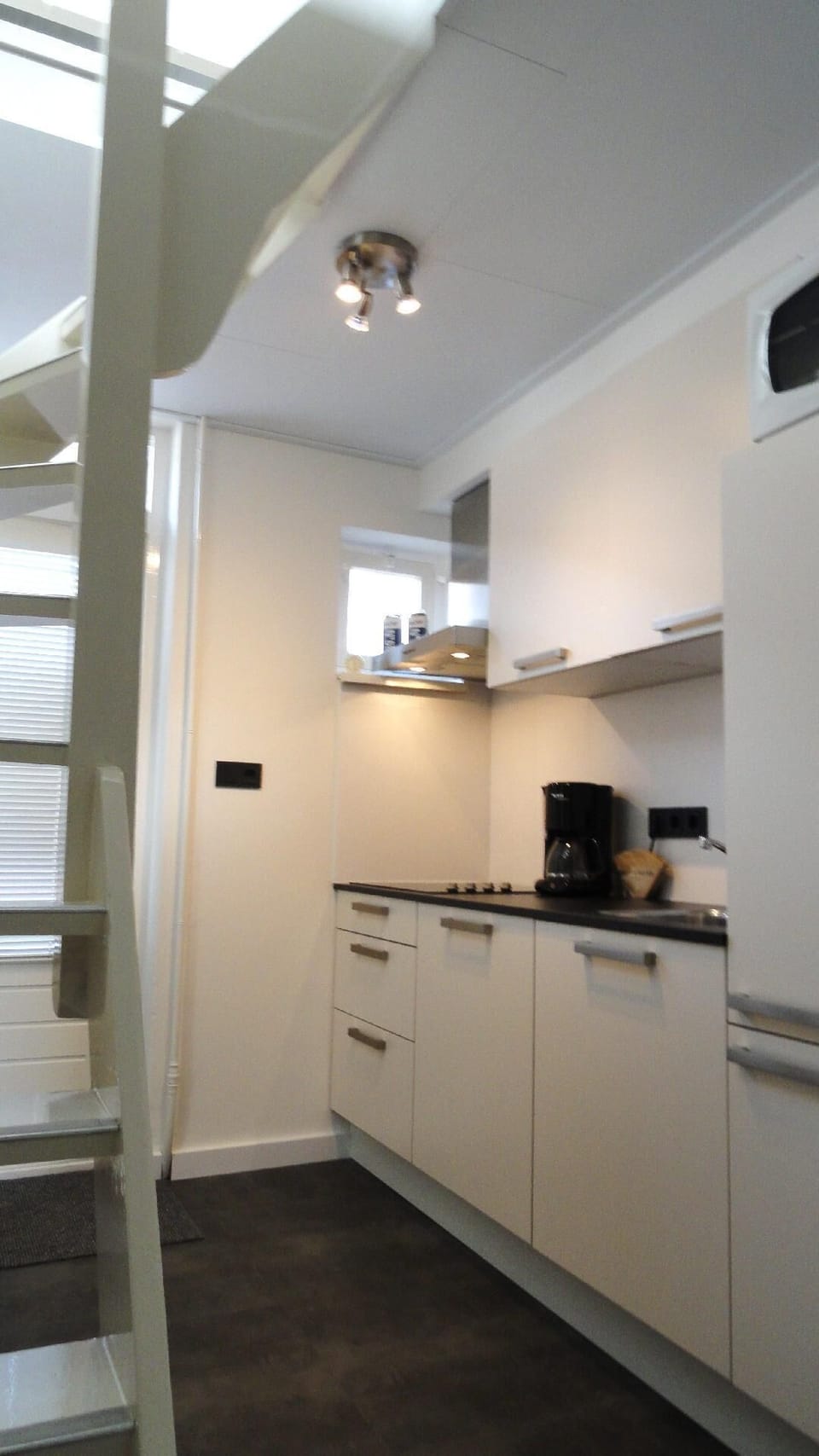 kitchen with the stairs to the upper floor
