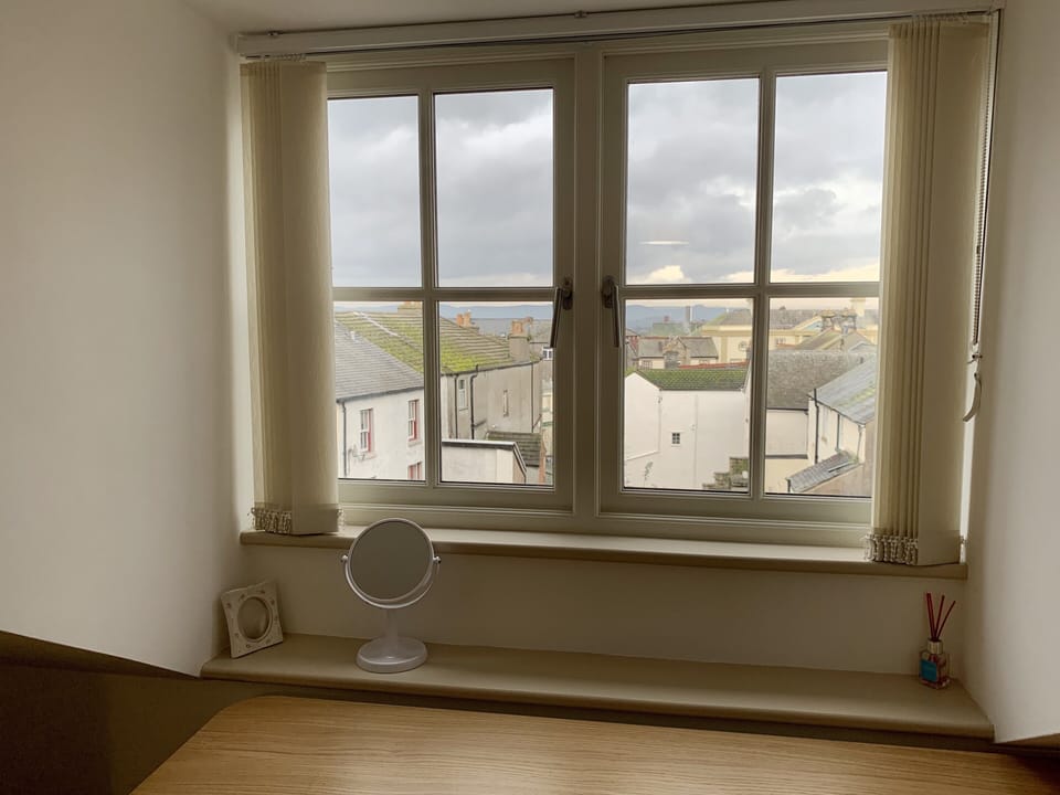 Third floor bedroom looking out to hills