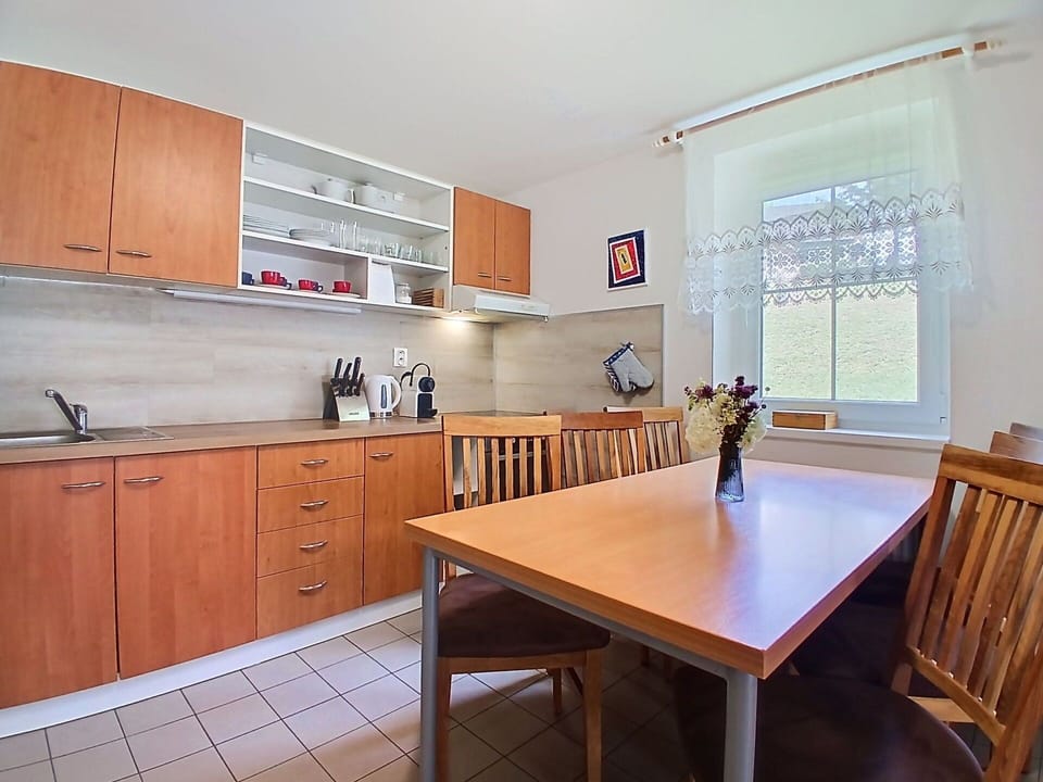Furniture, Flooring, Wood, Interior Design, Floor, Cabinetry, Kitchen, Countertop, Lighting, Room