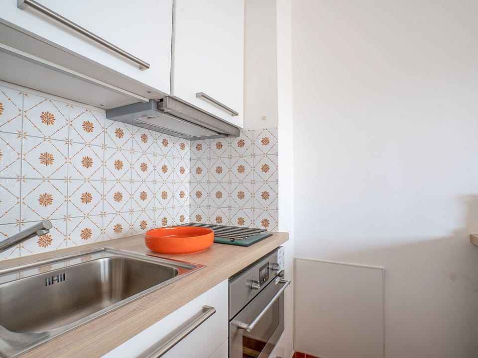 Property, Orange, Room, Furniture, Kitchen, Tile, House, Countertop, Interior Design, Cabinetry