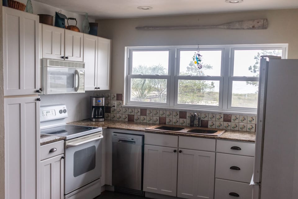 Two fully stocked kitchens