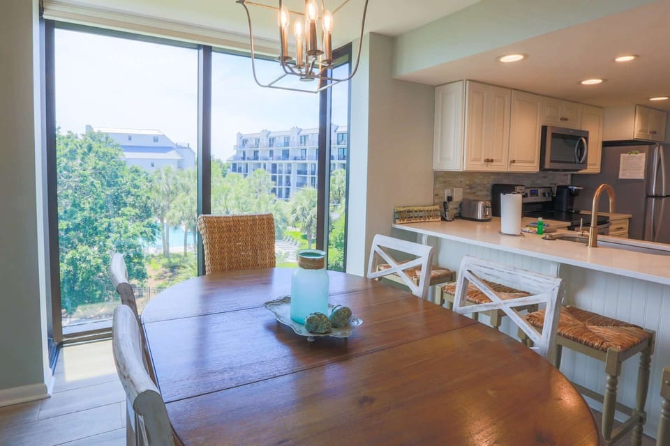 The dining room windows look out onto the Shipwatch community pool.