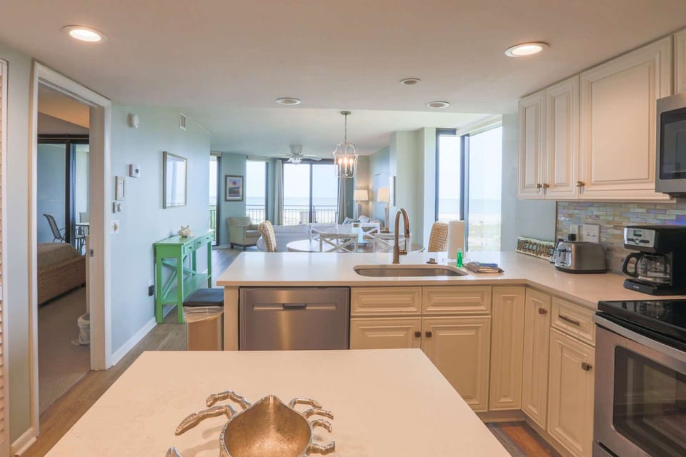 The open layout between the kitchen, dining area and living room make it easy to interact with your guests.