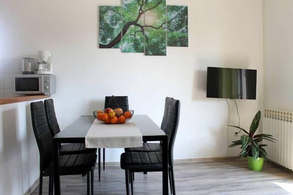 Dining area. Dining table and HD satelite tv