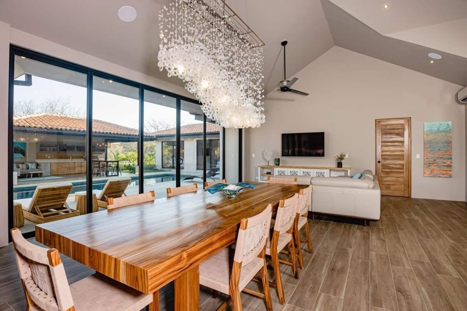 Dining and living room view to the pool