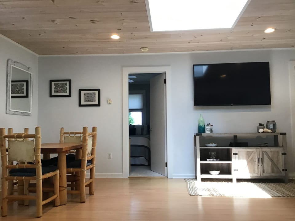 60” Smart TV equipped with cable, Netflix, and PlayStation 4