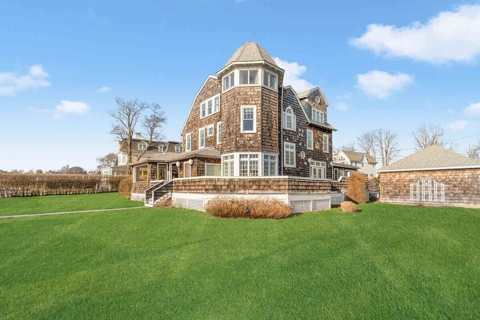 Enjoy lawn games while others sip cocktails on the porch overlooking the bay.