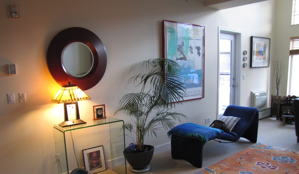 Sitting area with amazing blue couch and the Tibetan rug