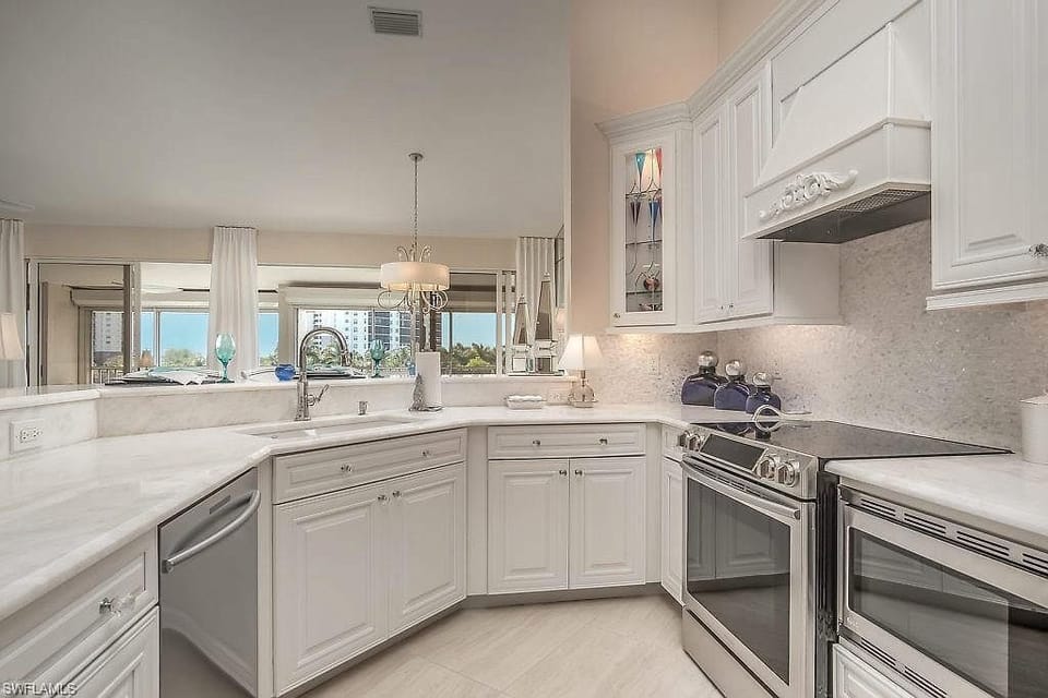 Brand new kitchen appliances, cabinets and marble counter tops
