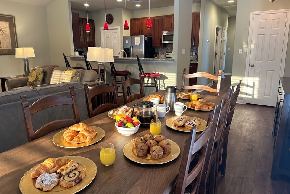 Spacious dining table set for shared meals, memories, and holiday gatherings.
