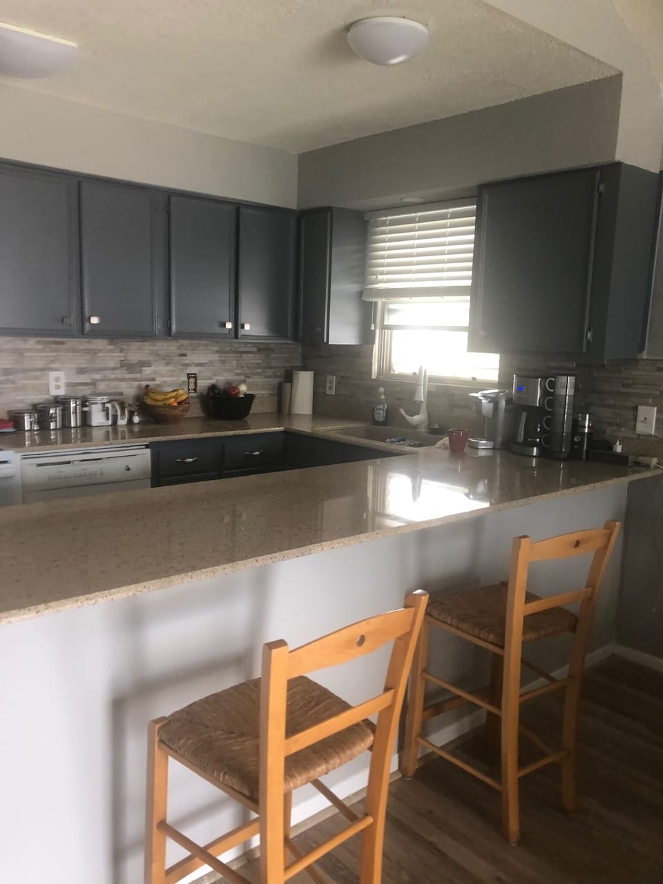 Well stocked kitchen seats four.