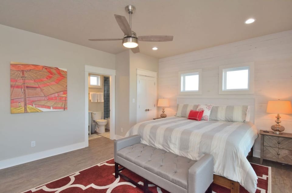 2nd floor king bedroom #3 with en suite bathroom, balcony access and 50 in tv.