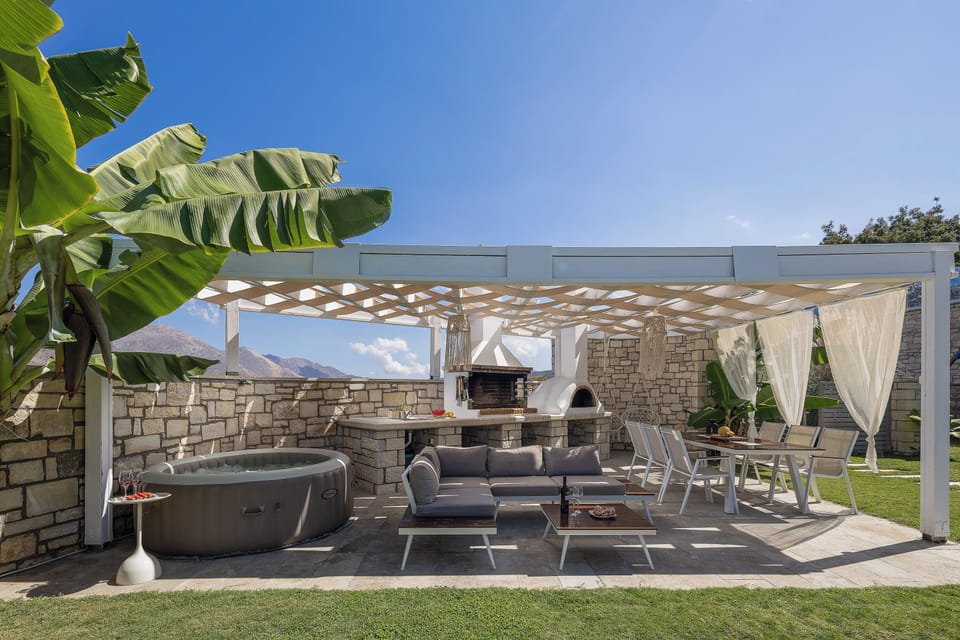 A premium al fresco haven featuring a 4 seater inflatable hot tub and wood oven