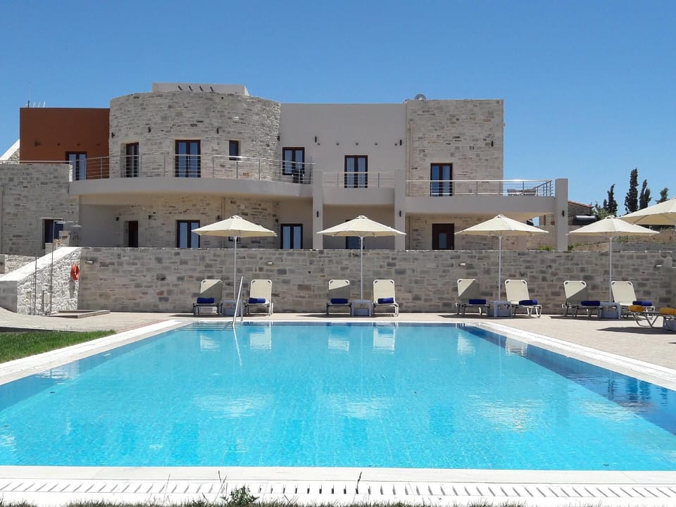 External view of the building. The 82sqm swimming pool with free umbrellas and sunbeds