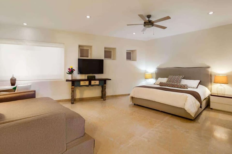 Private bedroom with tropical decor and closet space

