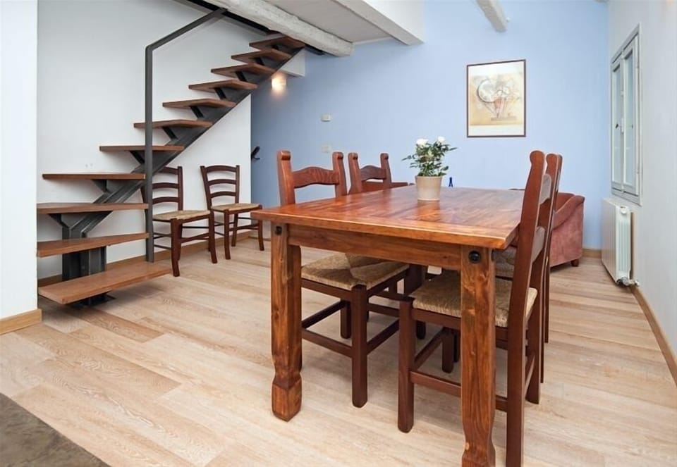 living room with a staircase leading the mansard