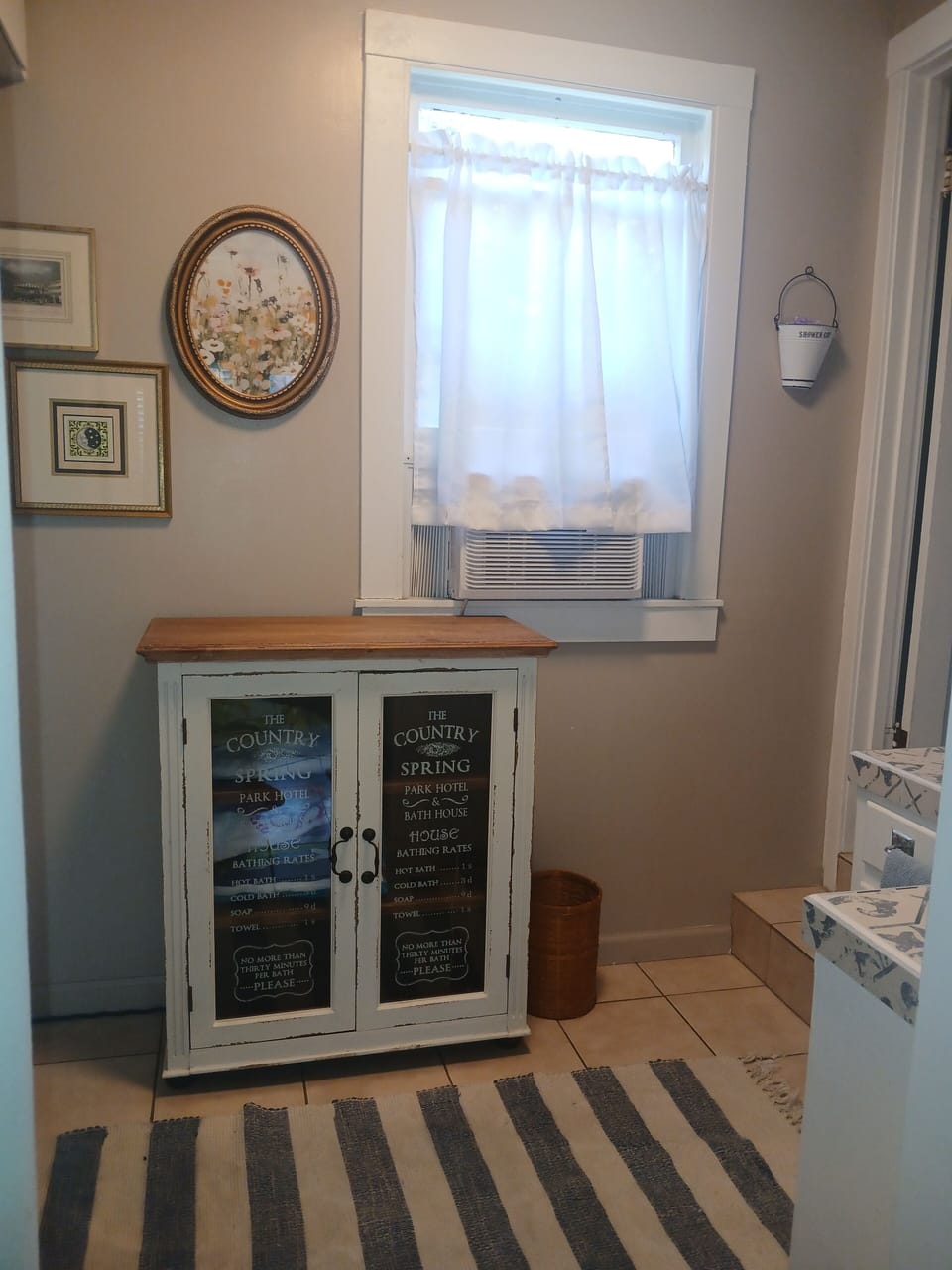 Cabinet space with beach towels and table cloths.