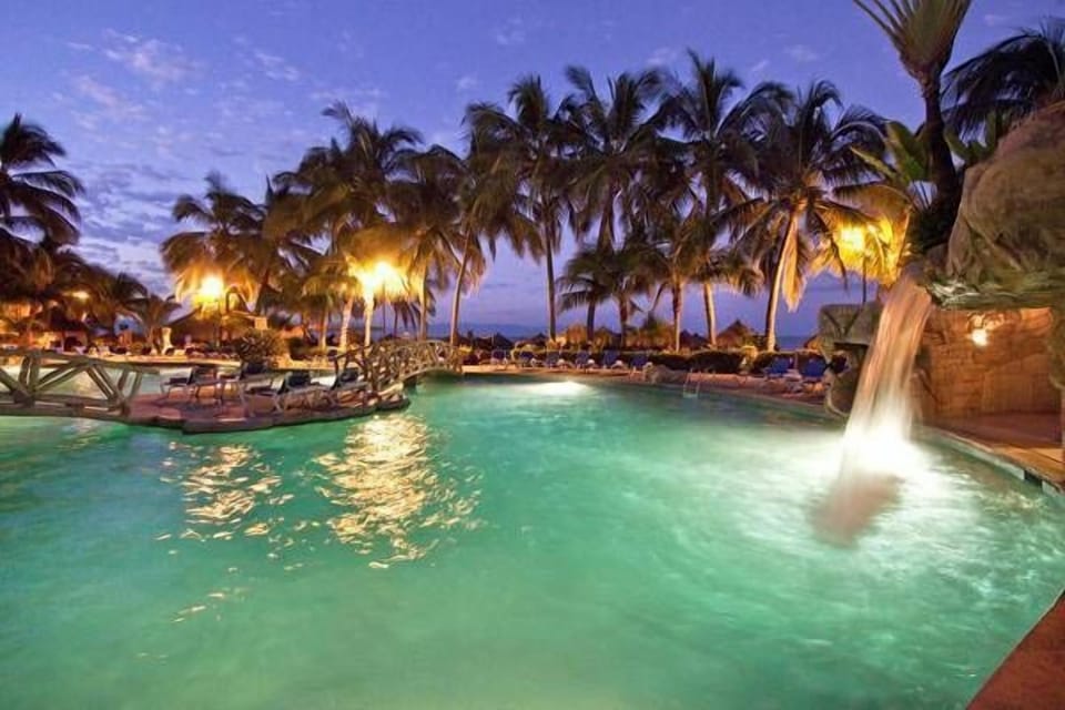 Pool at Night with Waterfall