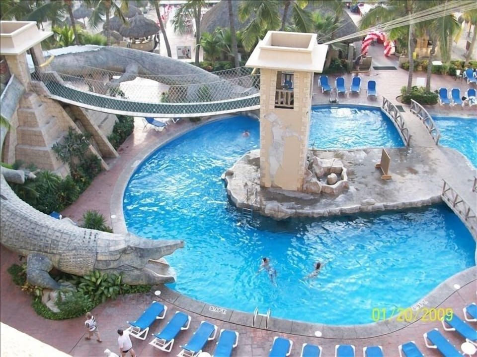 One of the Paradise Village Pools with Alligator Slides, Rope Bridge & Caves