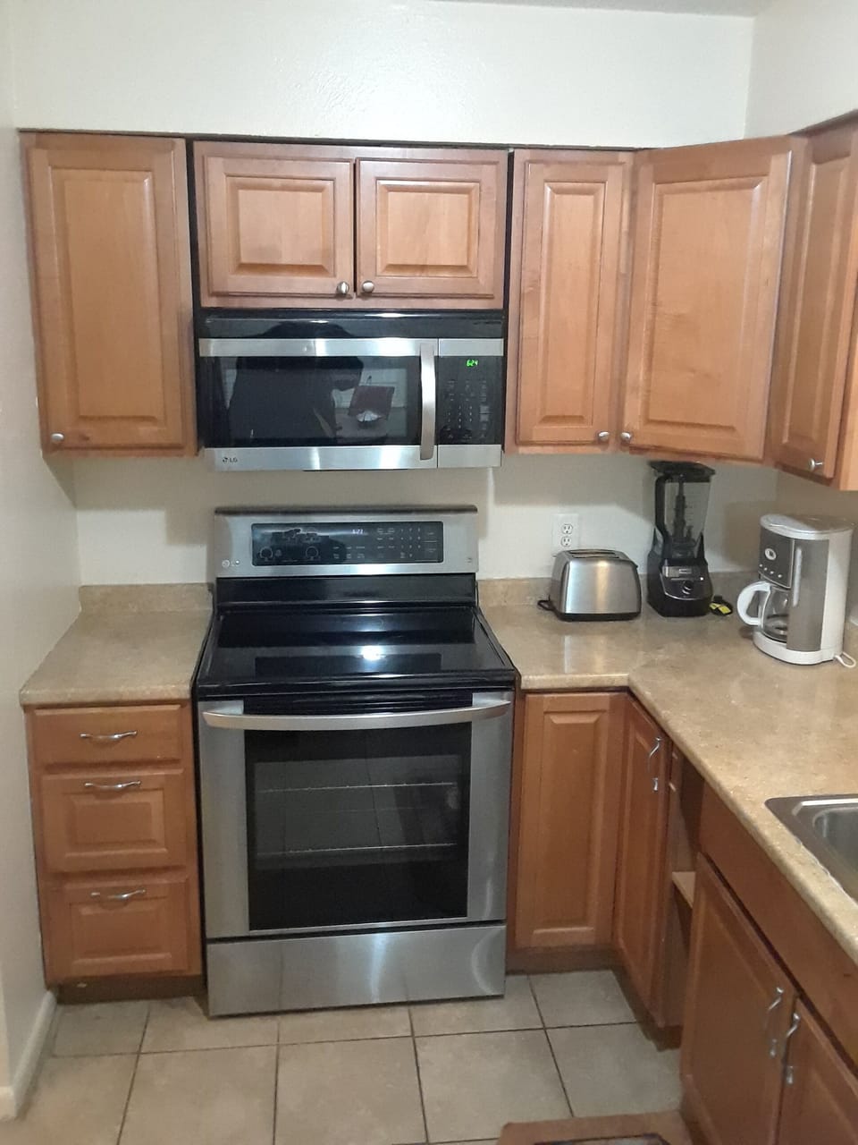 Stainless Steel Stove and overhead microwave. 