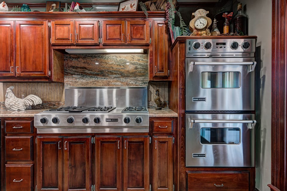 Double ovens and 6 burner cook top, microwave.