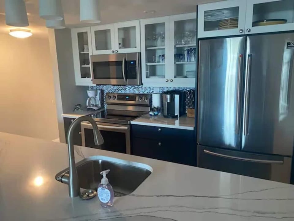 The fully equipped kitchen comes with all the modern appliances you need.