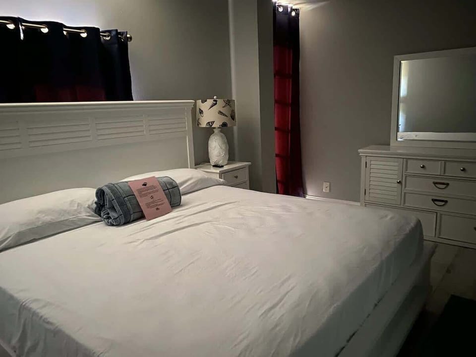Drift into deep sleep in this plush king-sized bed.