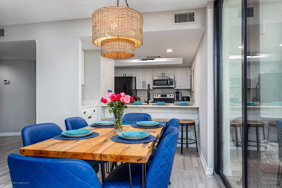 Gorgeous wood dining table for 6 plus 4 stool seats at the new marble kitchen counter.  Beautiful !
