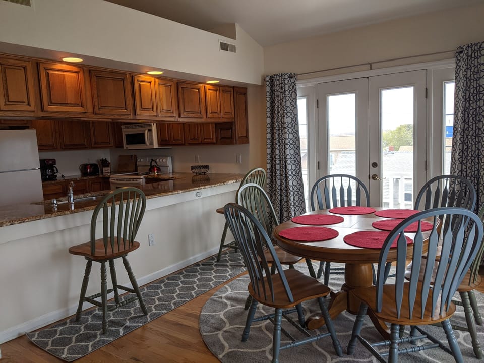 View of the dining area overlooking kitchen. 