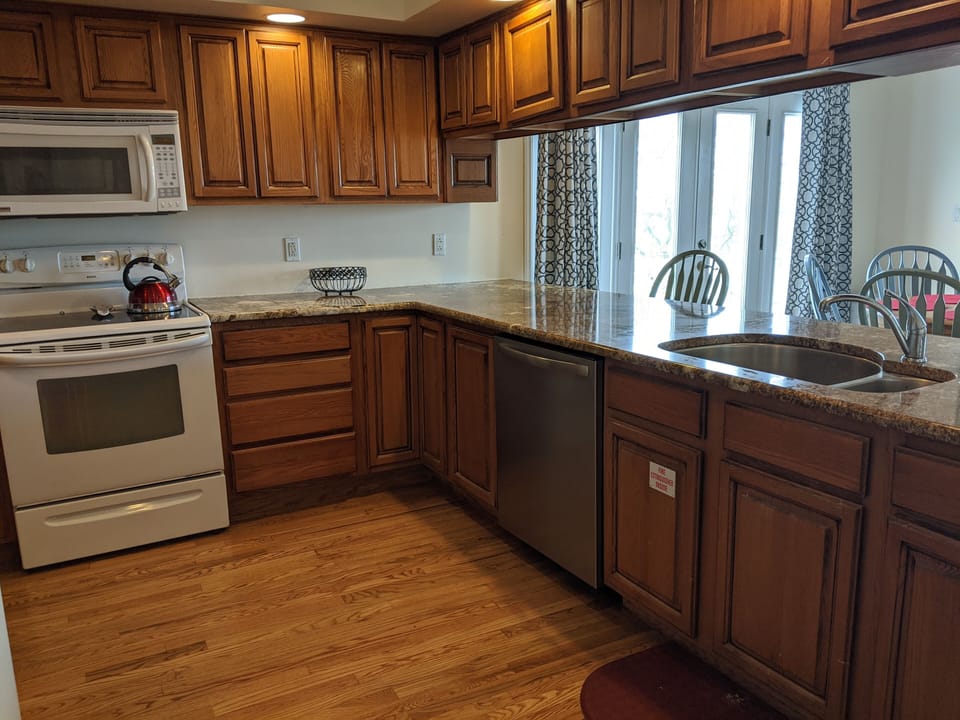 Open concept kitchen with dishwasher.