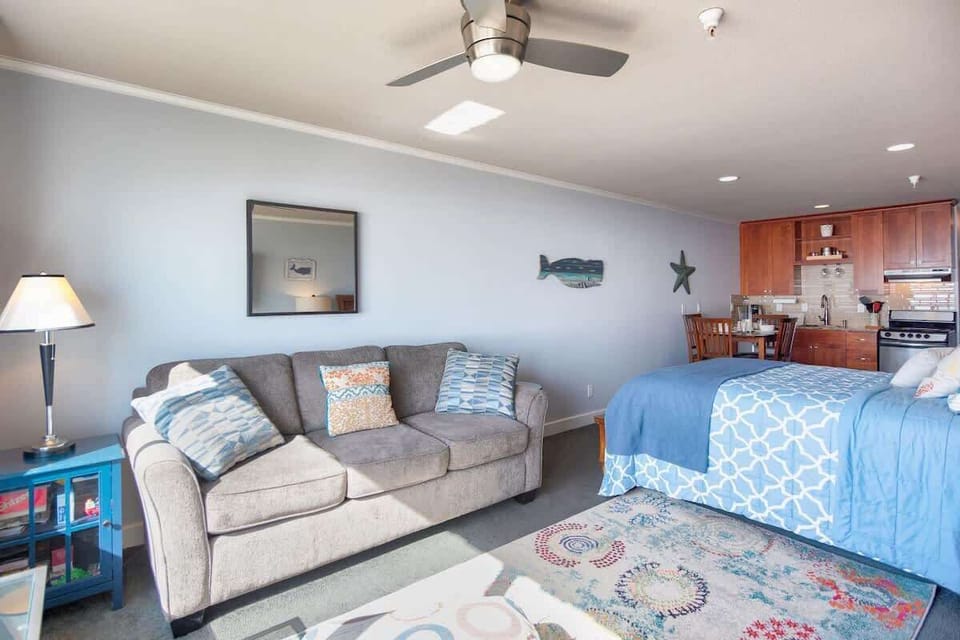 The studio has a queen bed and a pull-out sleeper sofa