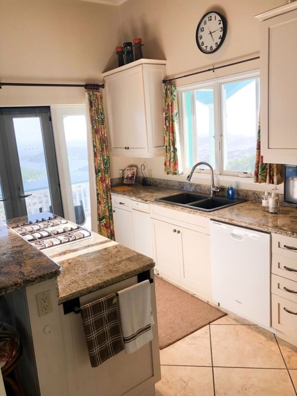 Kitchen with dining counter and stools
