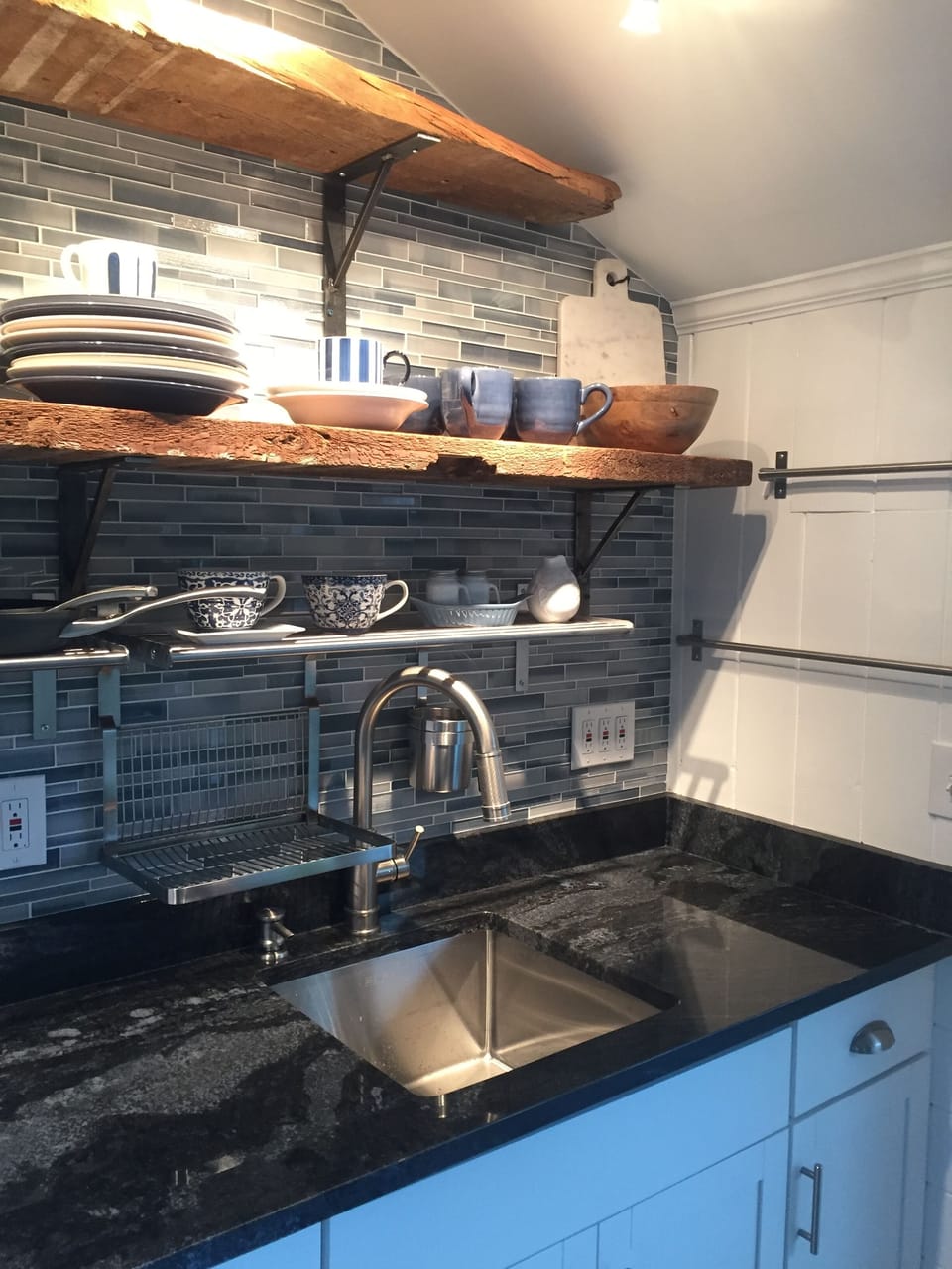 Redesigned kitchen with reclaimed wood shelving is part of recent upgrades