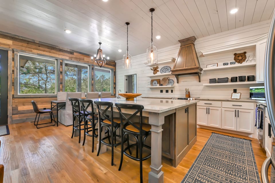 The kitchen and dining area combined have seats for 12.