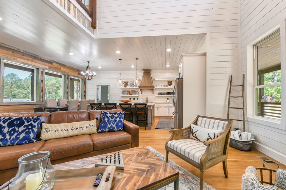 The living room seamlessly transitions into the kitchen/dining area.