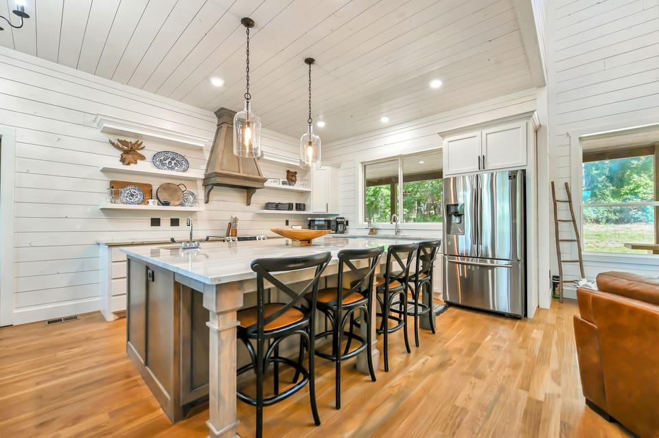 The kitchen provides extra seating at the island. 