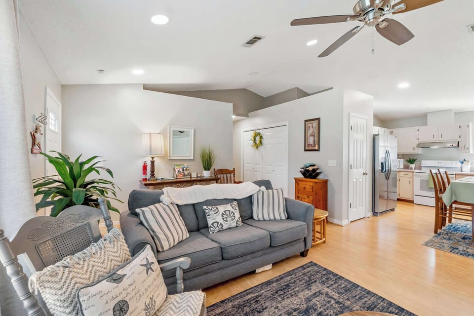 Airy, sunlit lounge with plush seating and soaring vaulted ceilings