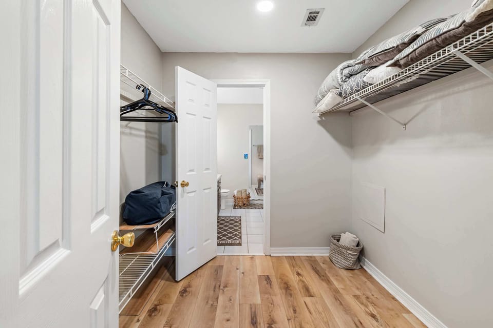 Stop living out of your suitcase! Our generous walk-in closet offers enough shelving and hanging space for your entire wardrobe, plus extra linens to ensure your stay is perfectly comfortable.