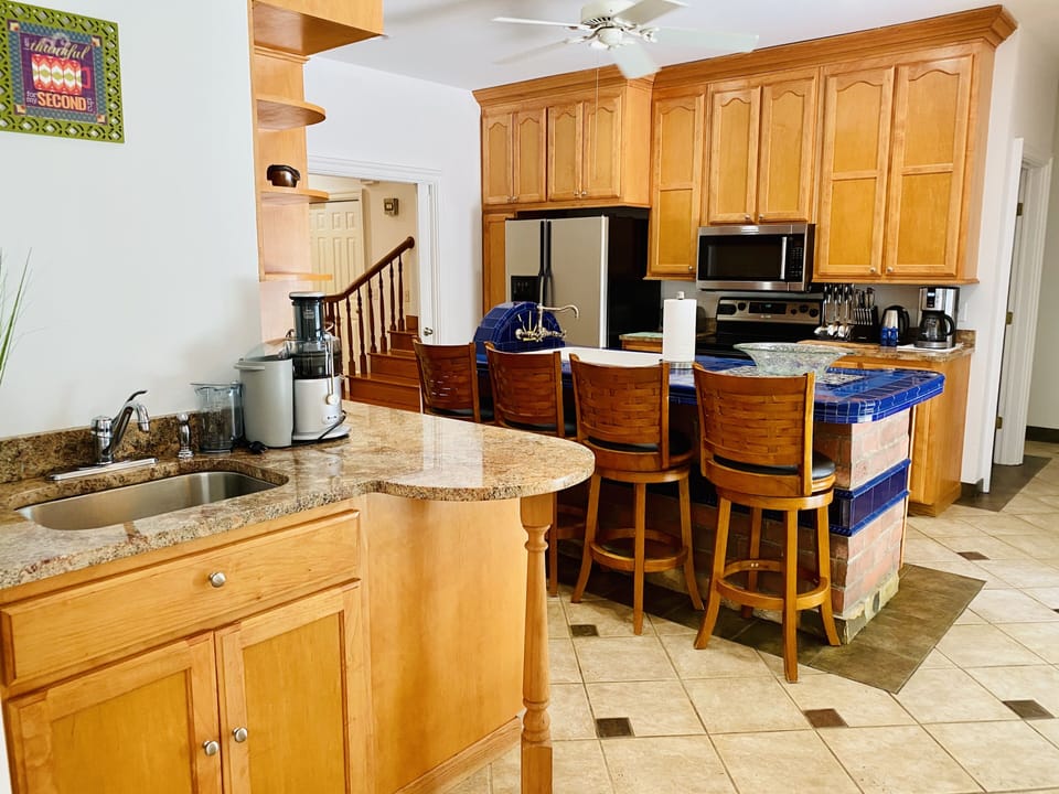 A generous kitchen with separate coffee station off the dining room