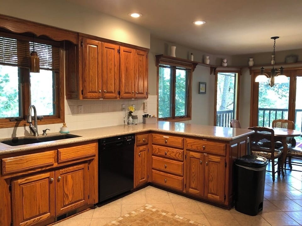 Kitchen with dining area and deck beyond