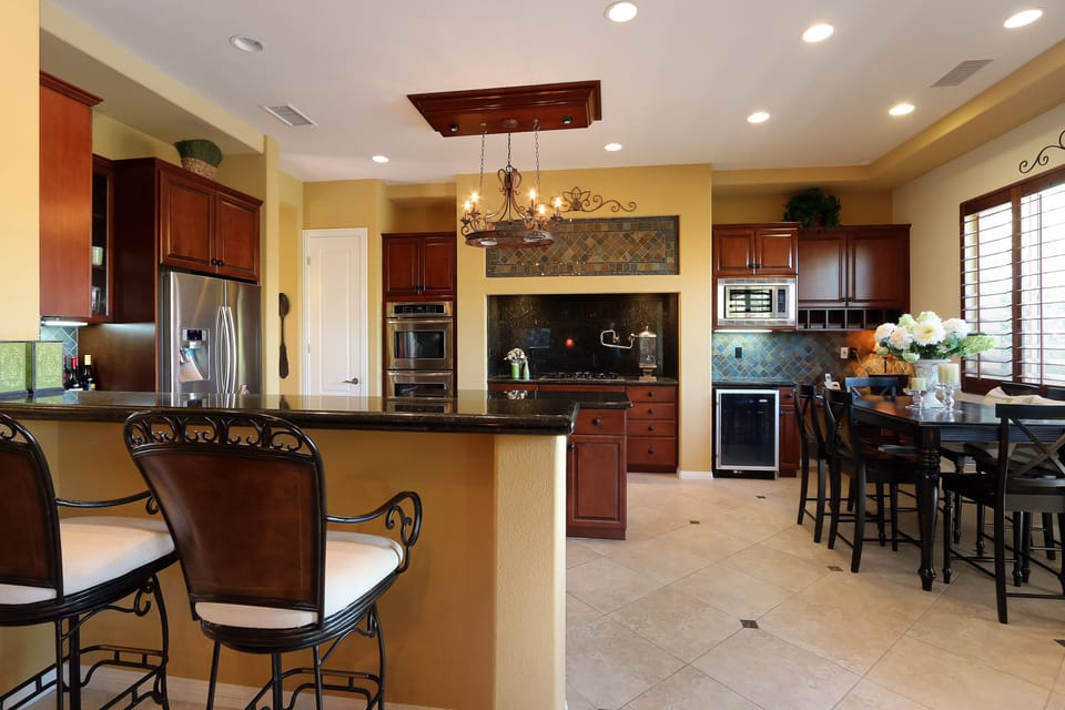 Open Kitchen with sitting area (featuring all newer stainless steel appliances)