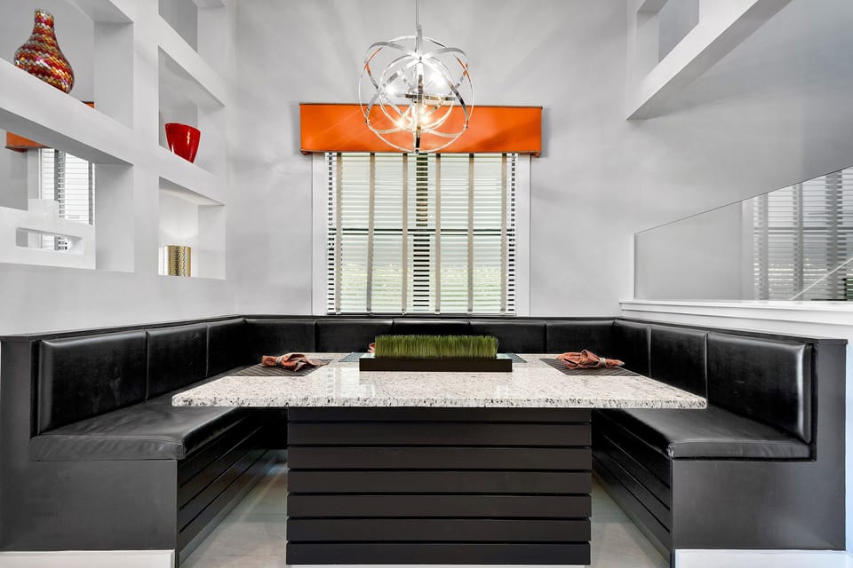 The booth-style dining area allows you to enjoy your meals with family comfortably